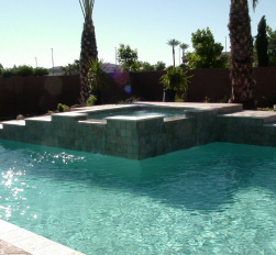 Stylish pool remodel with elevated spa and tile accents in Chandler