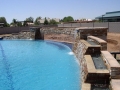 Custom Phoenix pool remodel with a new alternative water feature by True Blue Pools