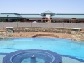 Alternative water feature added during a custom pool remodel by True Blue Pools