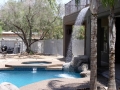 Gilbert pool with an alternative water feature crafted by True Blue Pools