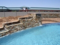 Mesa swimming pool featuring an alternative water feature by True Blue Pools