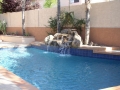 Homepage Features 7 — custom waterfall and fountain on a compact Phoenix, AZ pool by True Blue Pools