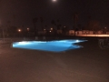 Pool lighting illuminating a backyard pool at night by True Blue Pools (4)