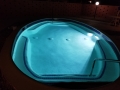 Spa glowing with custom nighttime pool and spa lighting by True Blue Pools (6)