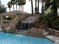Custom rock waterfall and waterslide pool in Gilbert by True Blue Pools