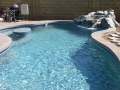Custom rock waterfall pool in Mesa, AZ by True Blue Pools