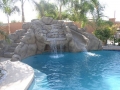 Huge custom rock wall waterfall on a Mesa pool remodel by True Blue Pools