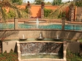 Multi-level poolscape with cascading scupper water features by True Blue Pools