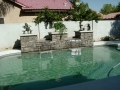 Custom pool scupper water fountain on a Phoenix backyard pool by True Blue Pools