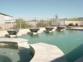 Custom water fountain scupper feature on a Gilbert pool remodel by True Blue Pools