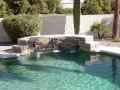 Pool with custom water fountain scuppers on a Gilbert remodel by True Blue Pools