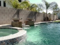 Pool with custom scupper water fountain on a Mesa remodel by True Blue Pools