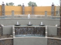 Large waterfall and scupper water feature on a Chandler pool remodel by True Blue Pools