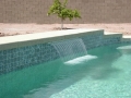 Mesa custom pool waterfall and fountain remodel with a sheer descent water feature by True Blue Pools