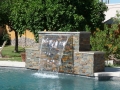 Mesa custom pool remodel with water fountain and sheer descent feature by True Blue Pools