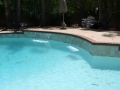 Mesa custom pool waterfall remodel featuring a sheer descent water feature by True Blue Pools