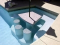 Mesa custom pool fountain and water feature remodel with built-in table and stools by True Blue Pools