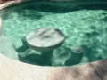 Tempe pool remodel with custom underwater bar table and stool seating by True Blue Pools