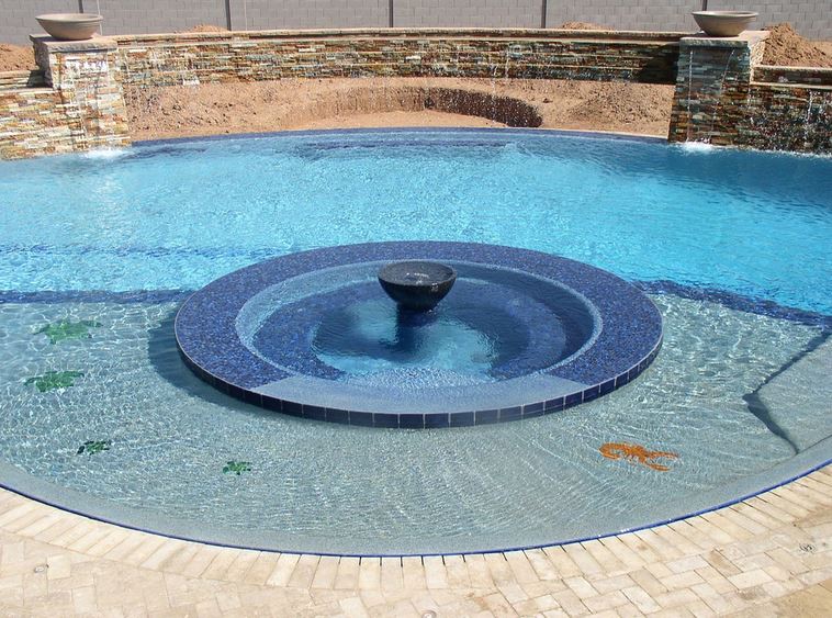Baja steps and beach entry custom pool in Mesa, AZ